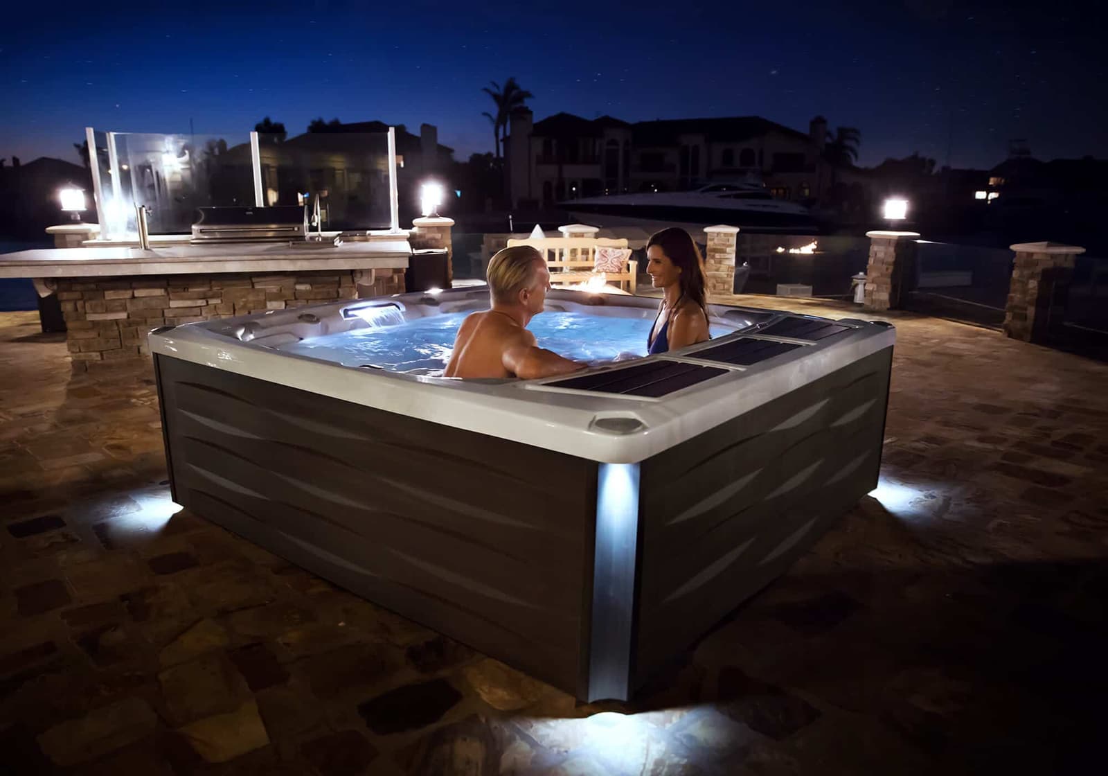 Sundance hot tub glowing at night